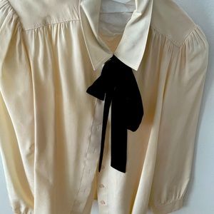 Poetic cream and black tie blouse.